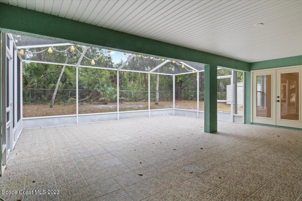 2405 Ruffner Road Melbourne, FL 32901 - Photo 28 of 35 a view of an empty room with wooden floor and balcony