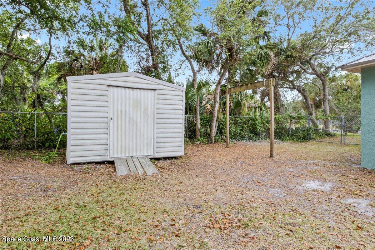 2405 Ruffner Road Melbourne, FL 32901 - Photo 30 of 35 a view of backyard with small cabin