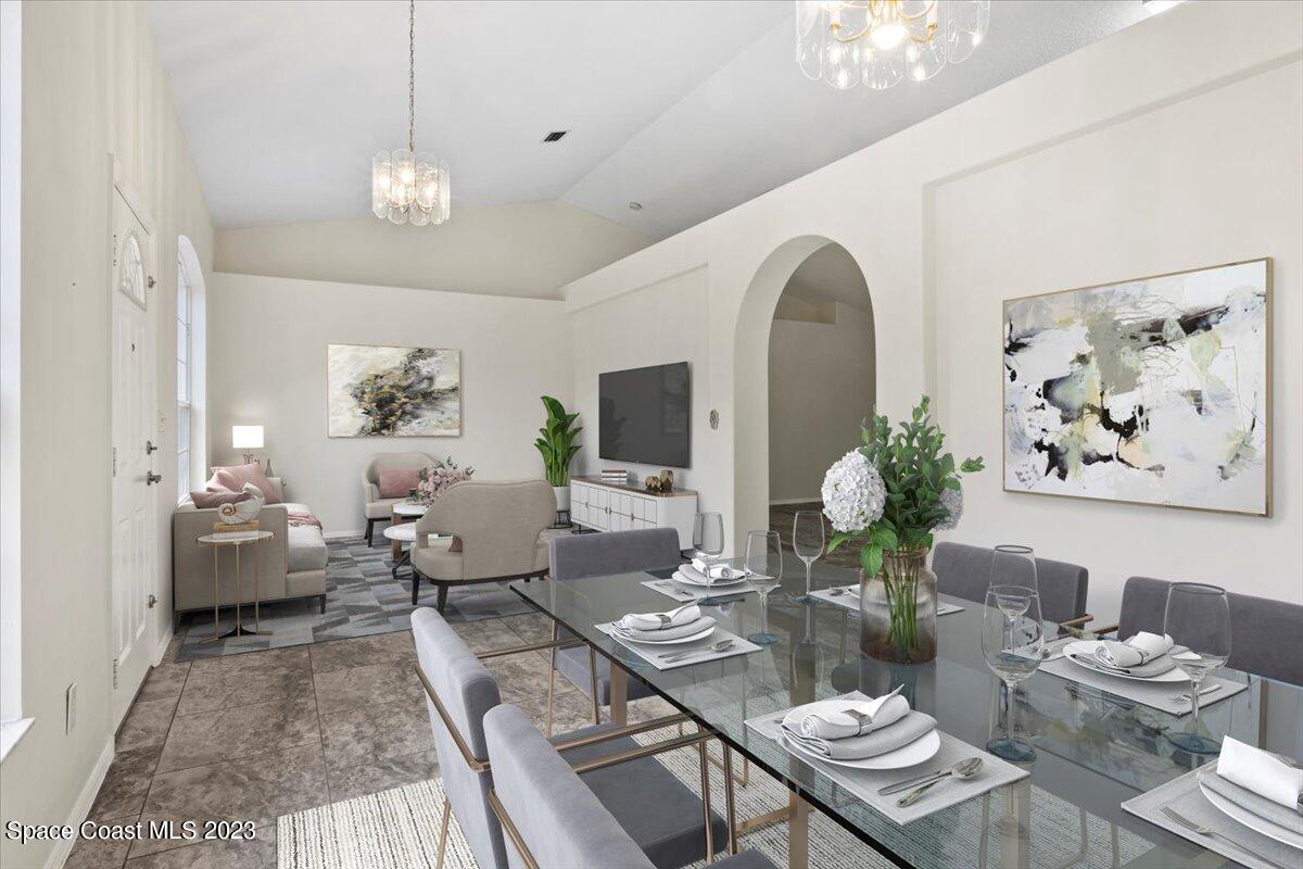 2405 Ruffner Road Melbourne, FL 32901 - Photo 5 of 35 a living room with furniture and a chandelier