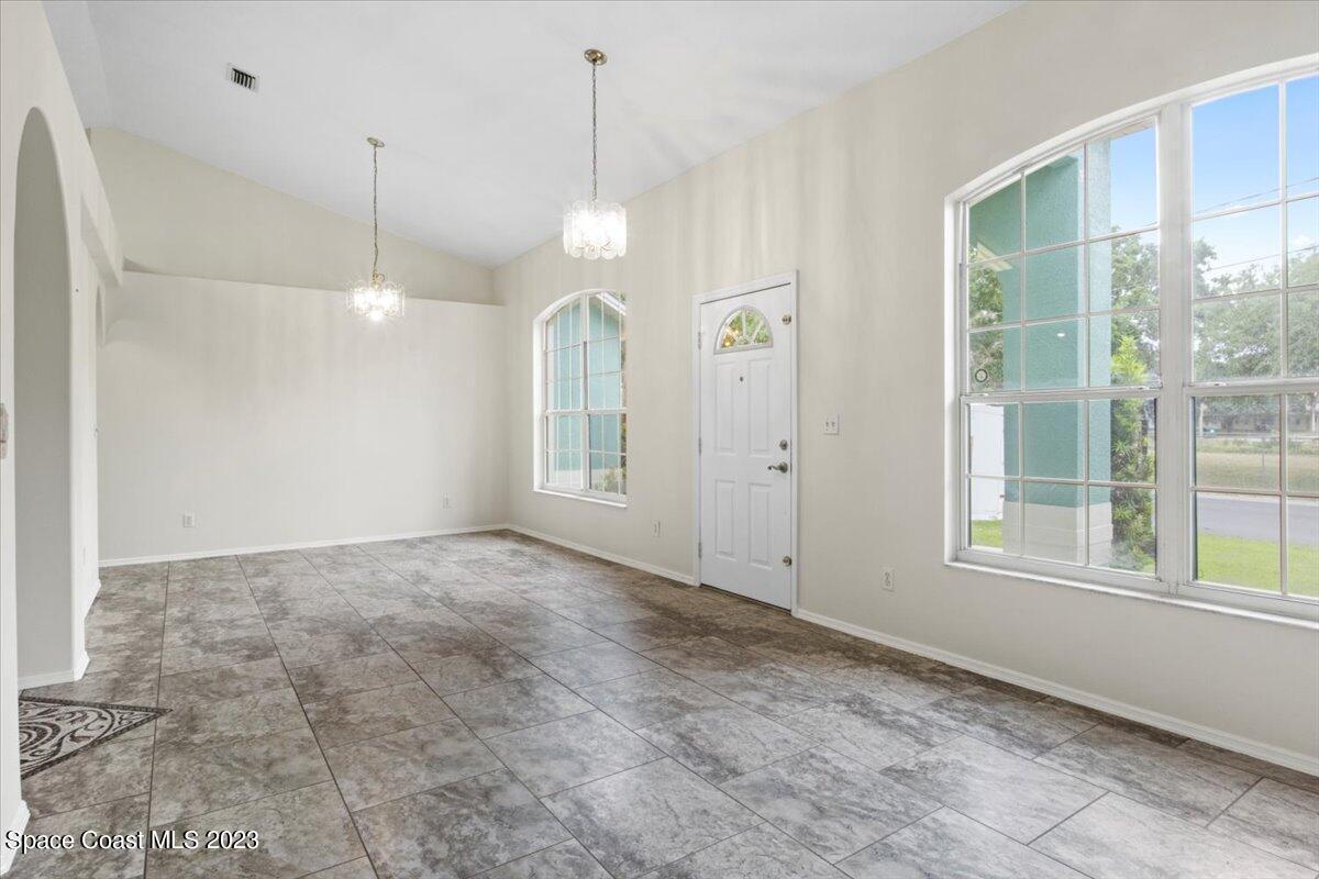 2405 Ruffner Road Melbourne, FL 32901 - Photo 6 of 35 a view of an empty room with a window