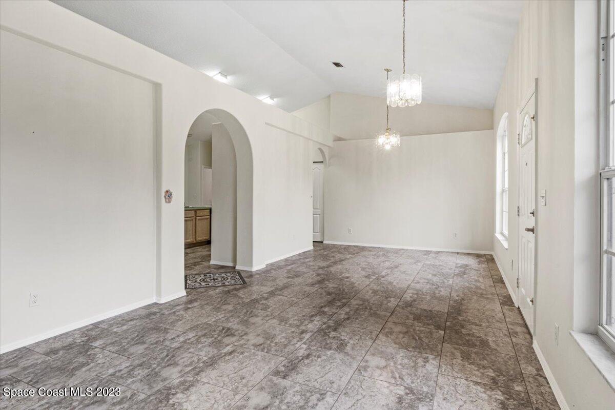 2405 Ruffner Road Melbourne, FL 32901 - Photo 7 of 35 a view of a room with a ceiling fan