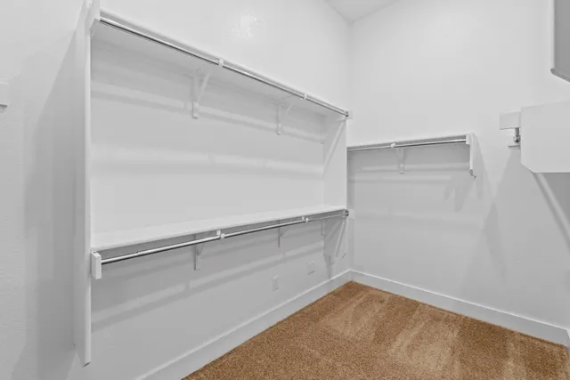 a view of an empty walk in closet
