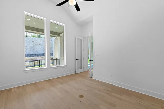 an empty room with a empty space and windows