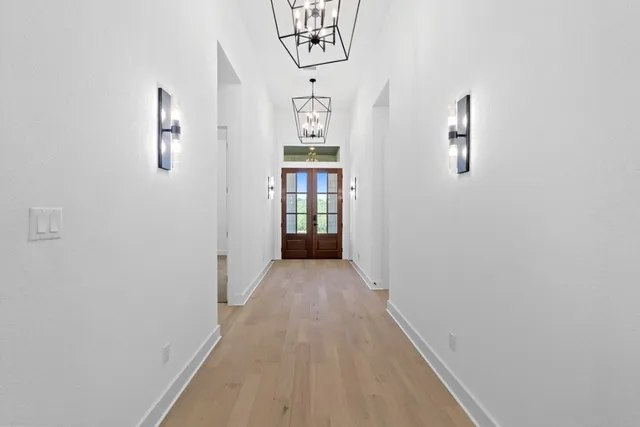 wooden floor in a gallery with front door