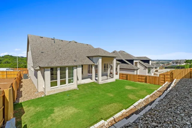 a view of a house with a garden and deck
