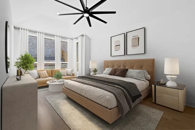 a bedroom with a large bed and a window