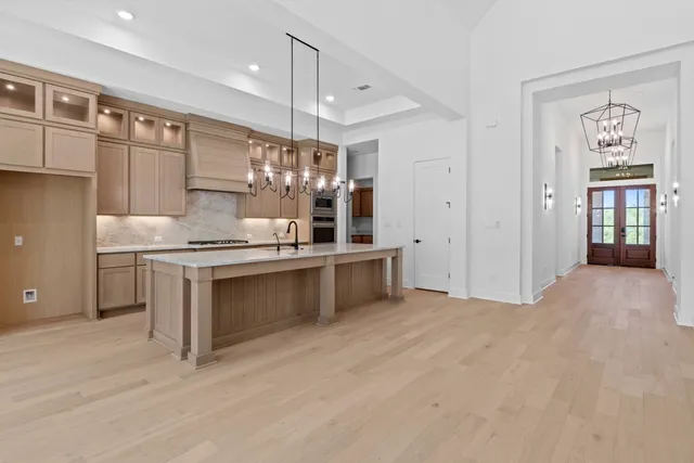 a kitchen with a refrigerator and window