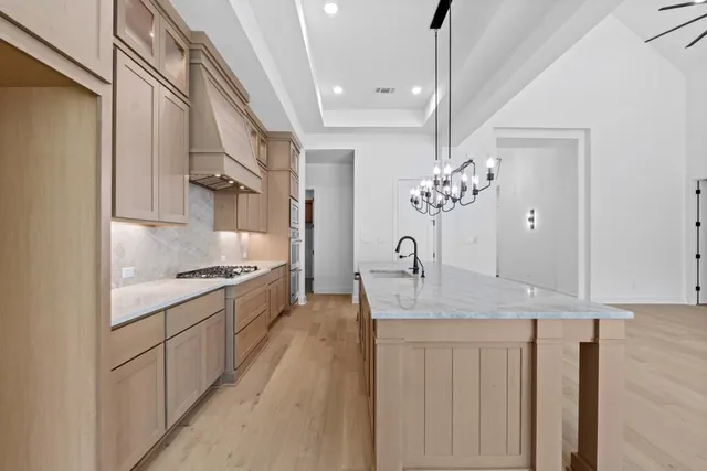 a kitchen with a sink and stove