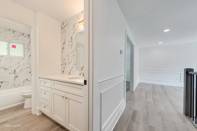 a bathroom with a sink a toilet and a bathtub