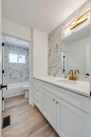 a bathroom with a bathtub and a sink