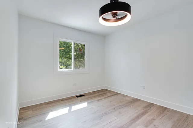 wooden floor with white walls