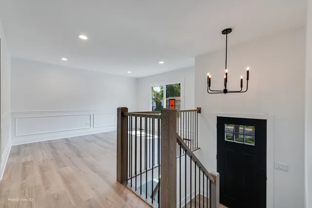 a view of a hallway with entryway door