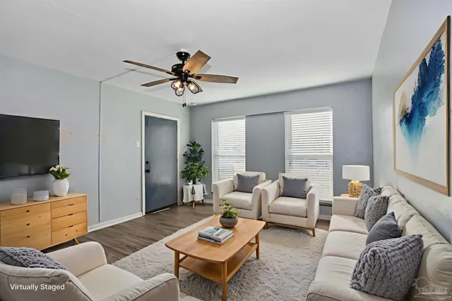 a living room with furniture or couch and a flat screen tv