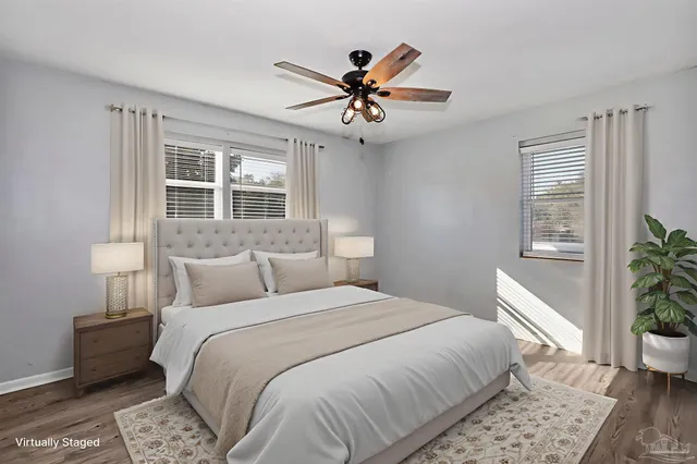 a bedroom with a large bed and a window