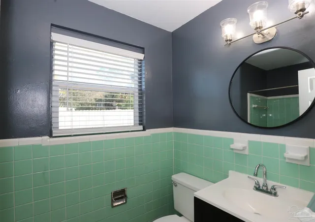 a bathroom with a sink and mirror