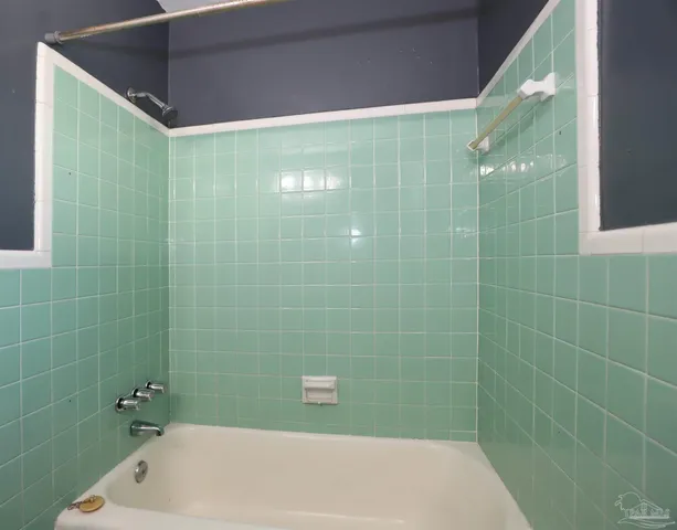 a bathroom with a shower and a bathtub