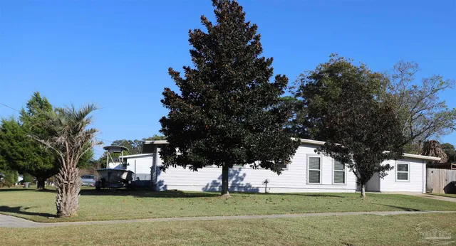 a view of a building with a yard