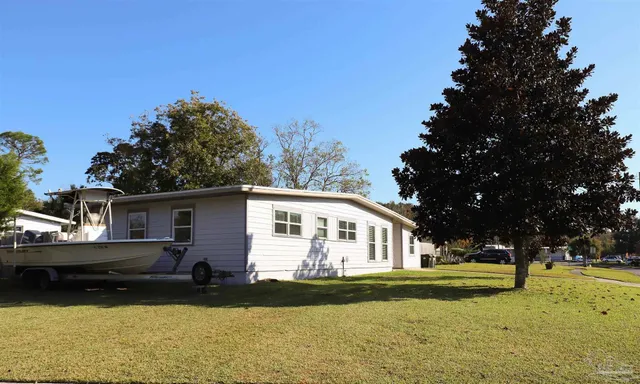 a view of house with outdoor space and swimming pool