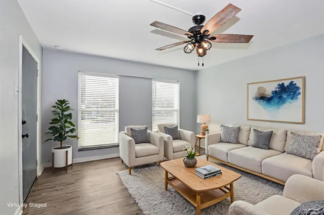 a living room with furniture and a large window