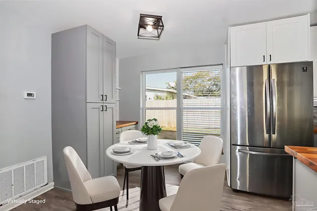a view of a dining room with furniture window and outside view