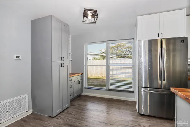 a kitchen with a refrigerator and countertop