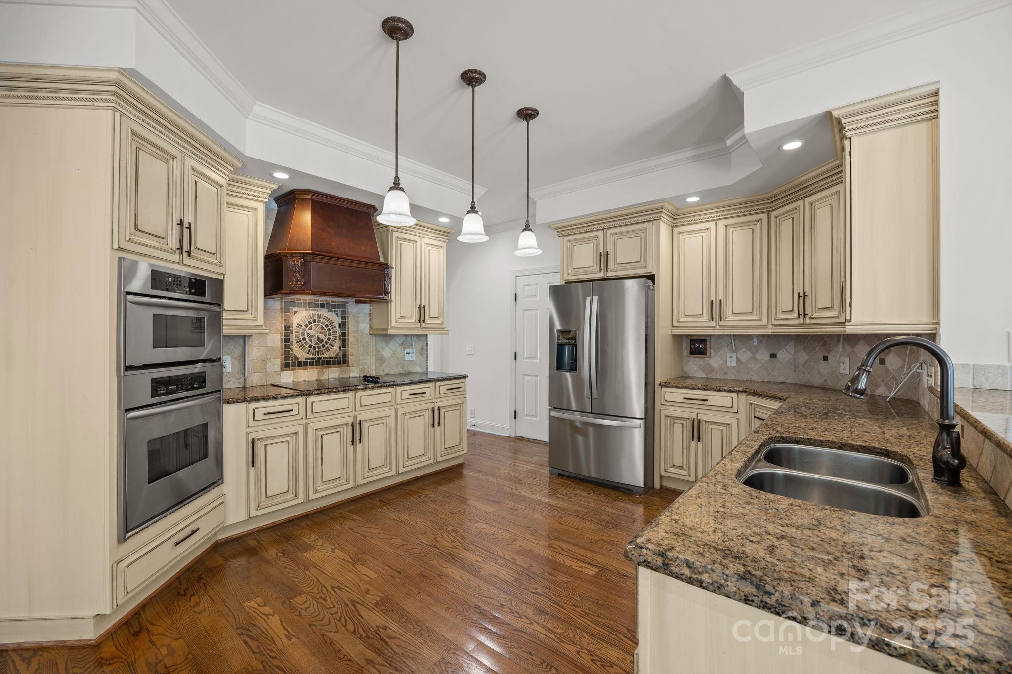 110 Devonshire Lane Salisbury, NC 28146 - Photo 14 of 48 a kitchen with stainless steel appliances granite countertop a refrigerator a stove and a sink
