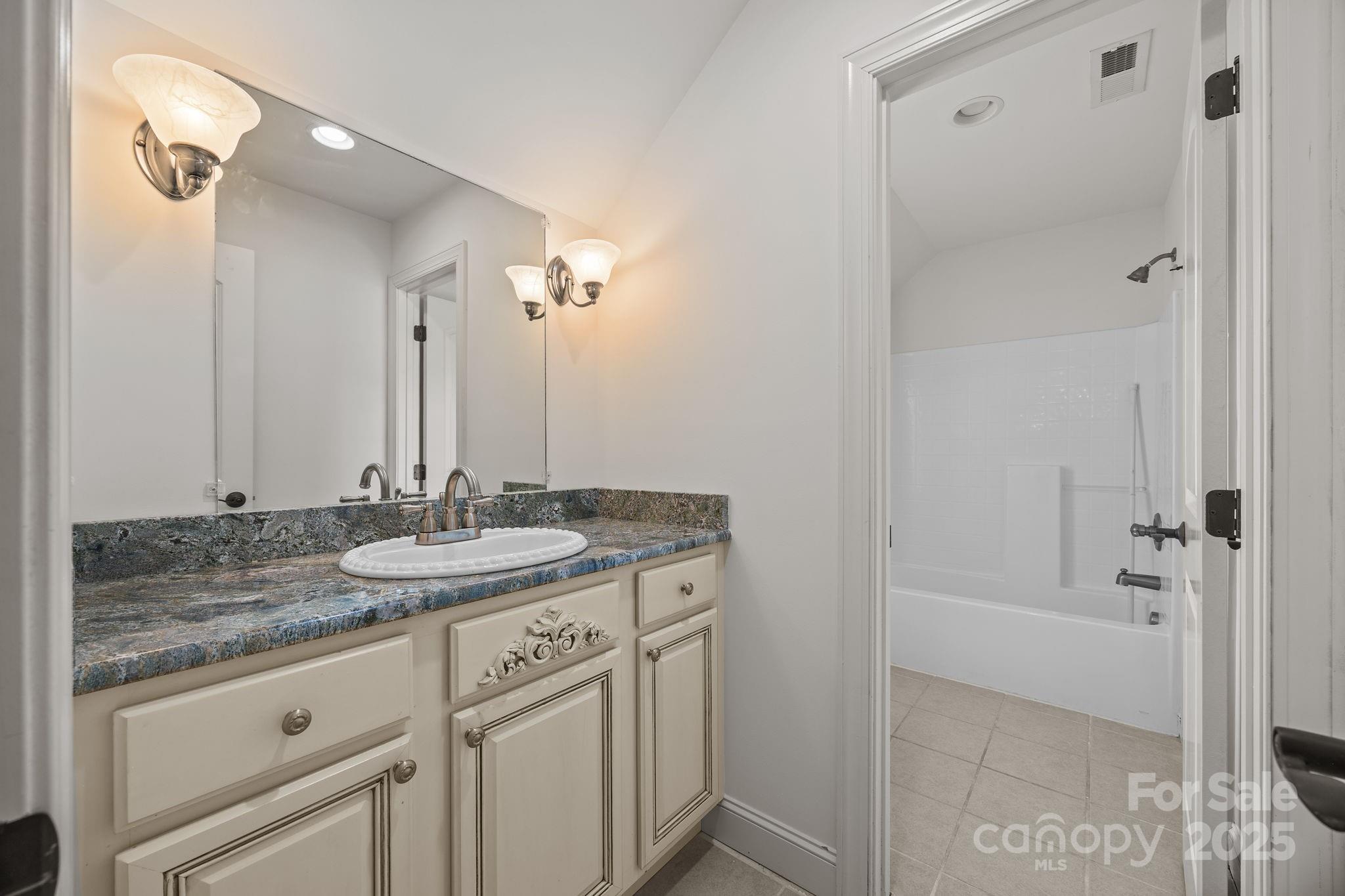 110 Devonshire Lane Salisbury, NC 28146 - Photo 32 of 48 a bathroom with a granite countertop sink and a mirror
