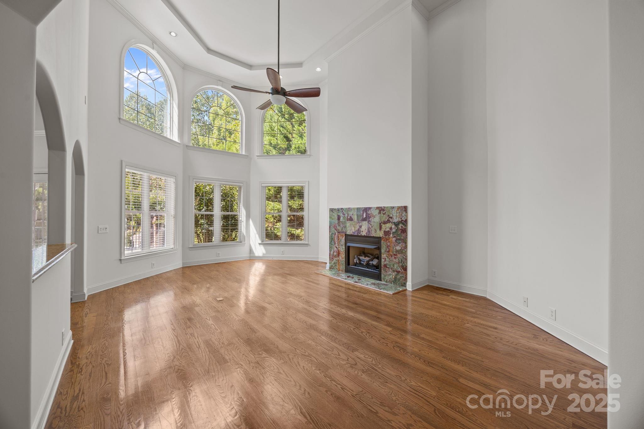 110 Devonshire Lane Salisbury, NC 28146 - Photo 10 of 48 a view of an empty room with a fireplace and a window