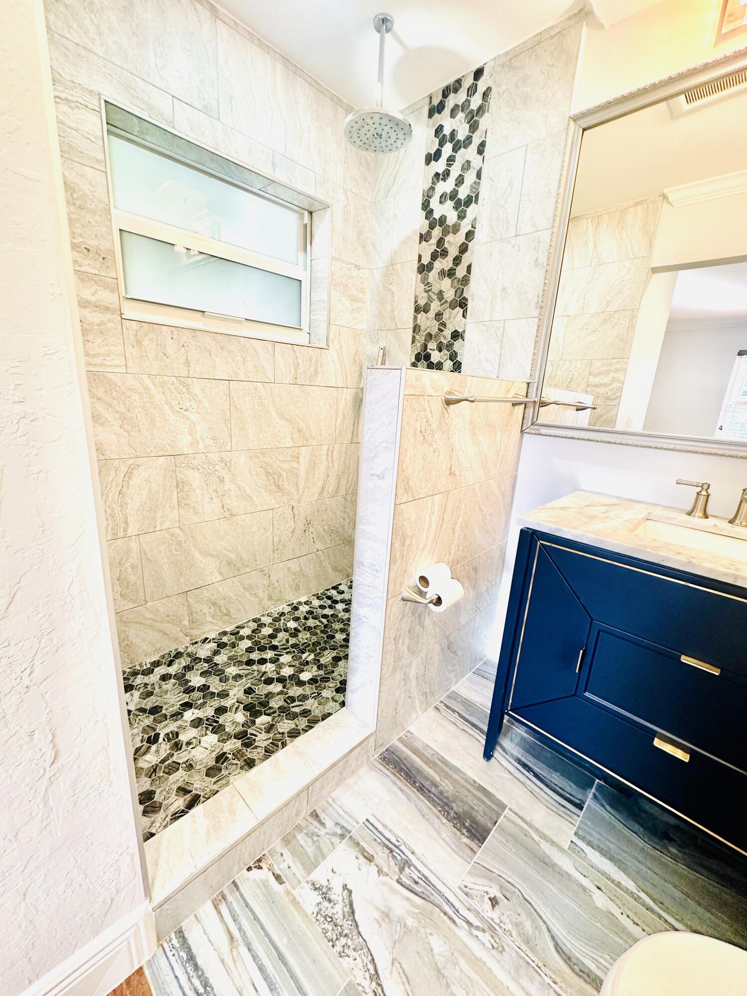 1104 Neoga Street Jupiter, FL 33458 - Photo 17 of 21 a bathroom with a sink and a shower