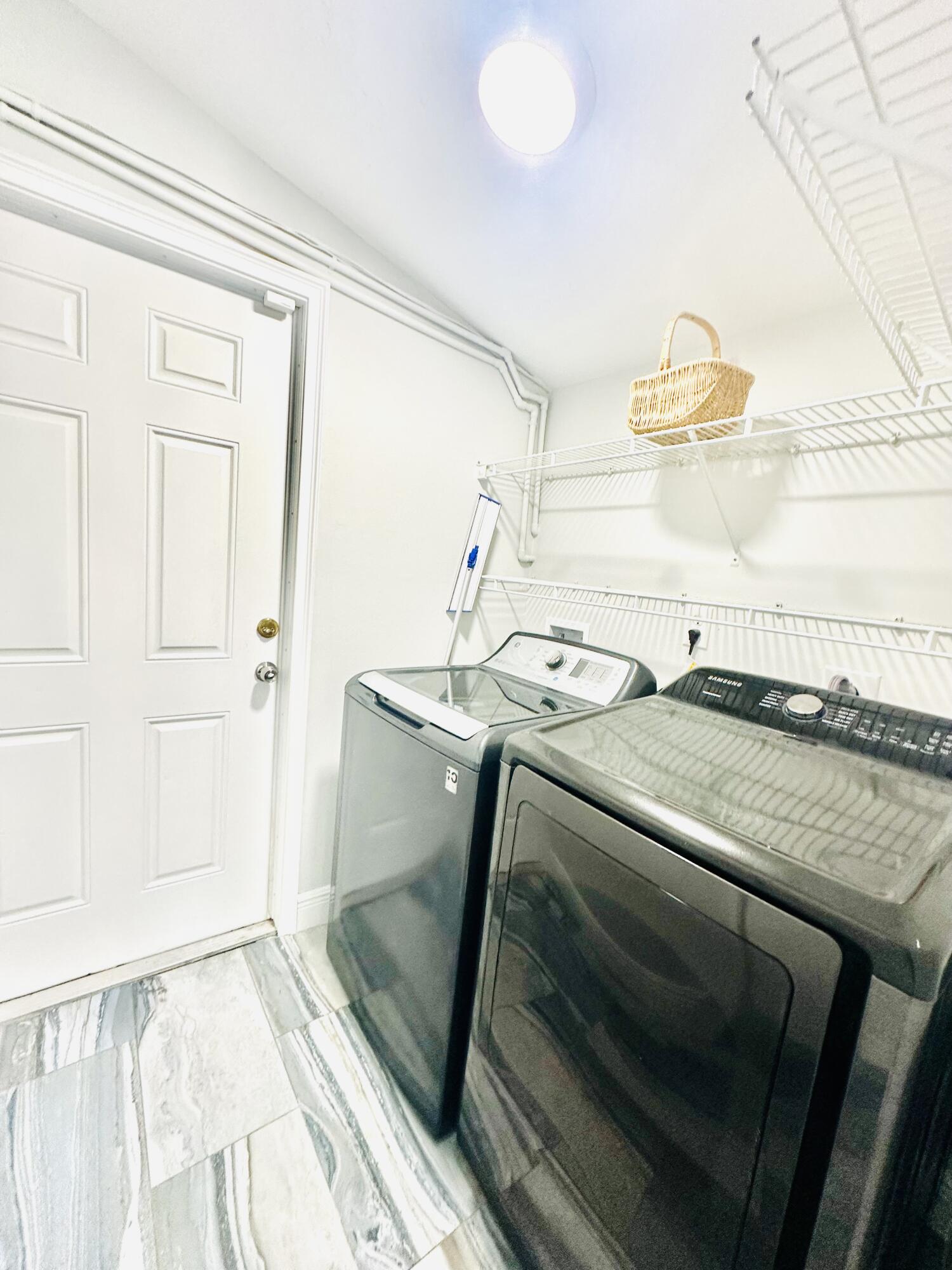 1104 Neoga Street Jupiter, FL 33458 - Photo 20 of 21 a bedroom with a bed and a large window