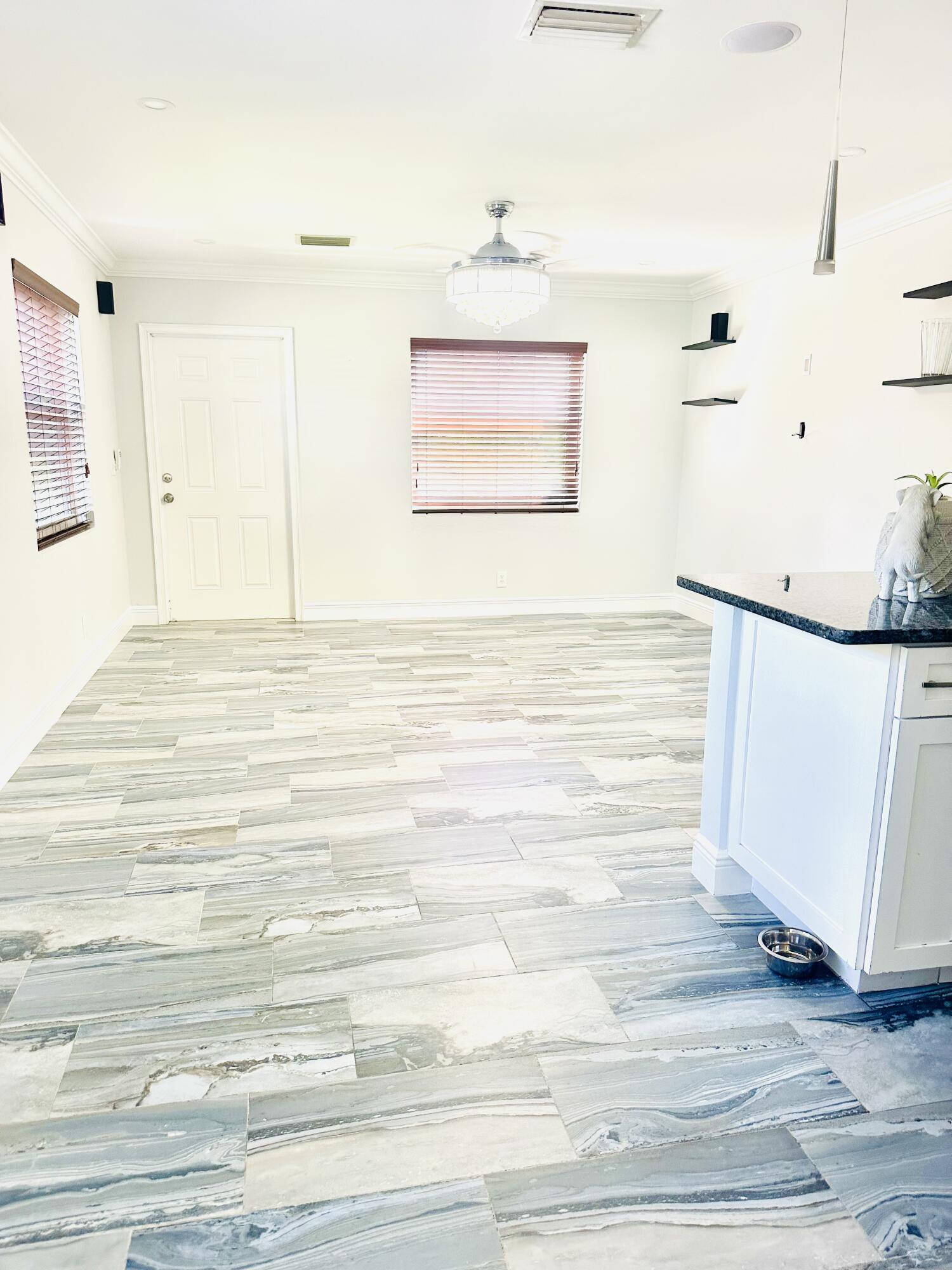 1104 Neoga Street Jupiter, FL 33458 - Photo 4 of 21 a view of a room with an empty space