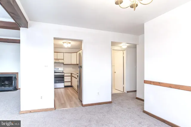 a view of a living room with windows