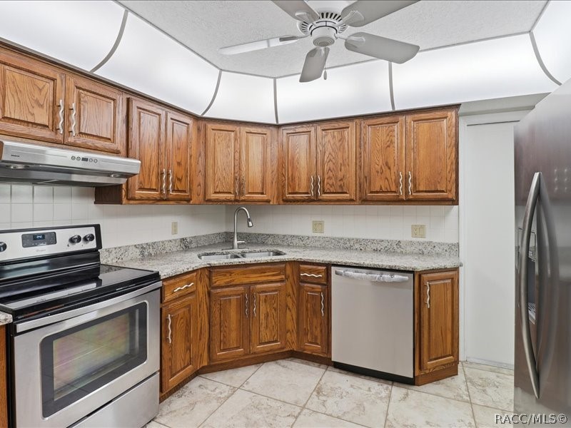 709 Moray Drive Inverness, FL 34453 - Photo 12 of 55 Kitchen with wood cabinets
