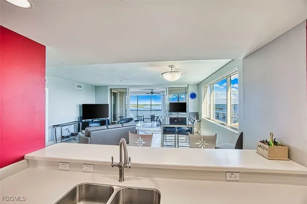 a living room with fireplace furniture and a flat screen tv