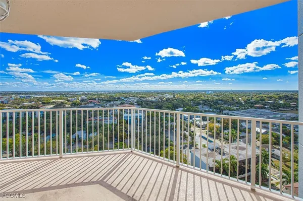 a view of balcony with furniture