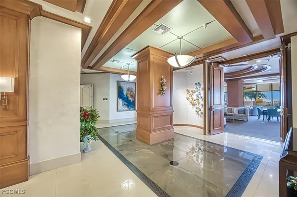 a bedroom with furniture and a flat screen tv