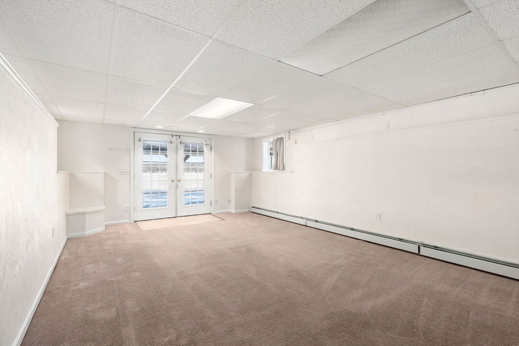 53-55 Point Pleasant Road Webster, MA 01570 - Photo 16 of 42 an empty room with windows