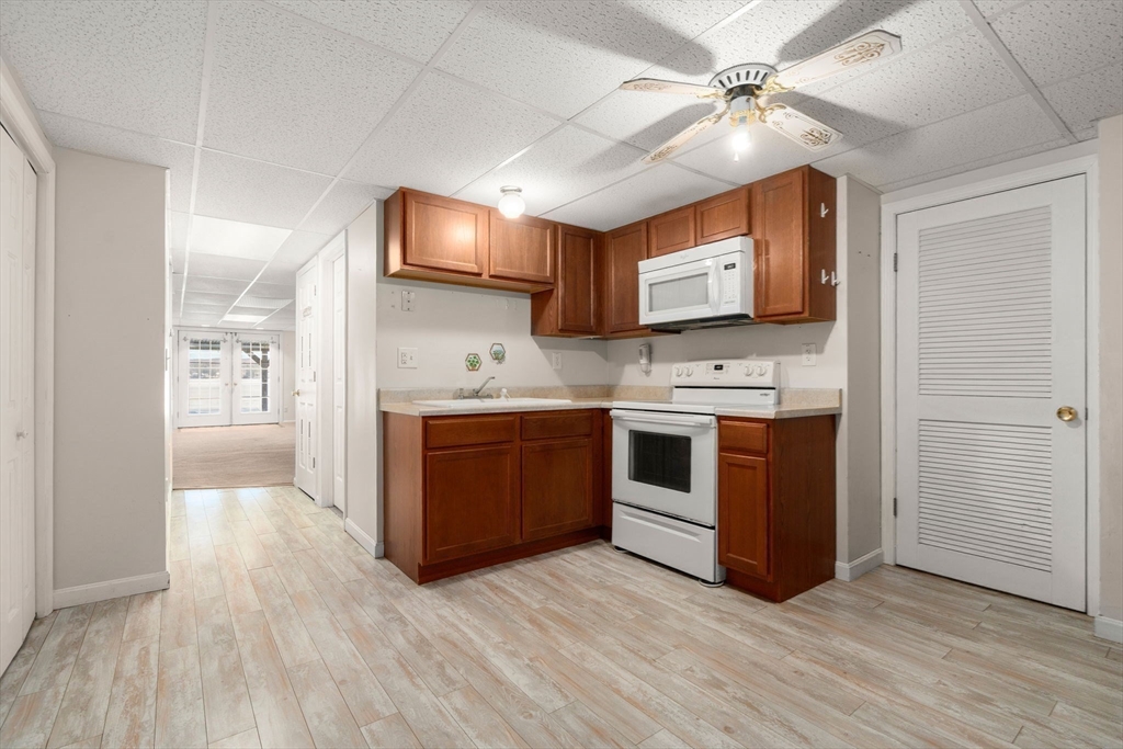 53-55 Point Pleasant Road Webster, MA 01570 - Photo 17 of 42 a kitchen with stainless steel appliances granite countertop a stove a sink and a refrigerator