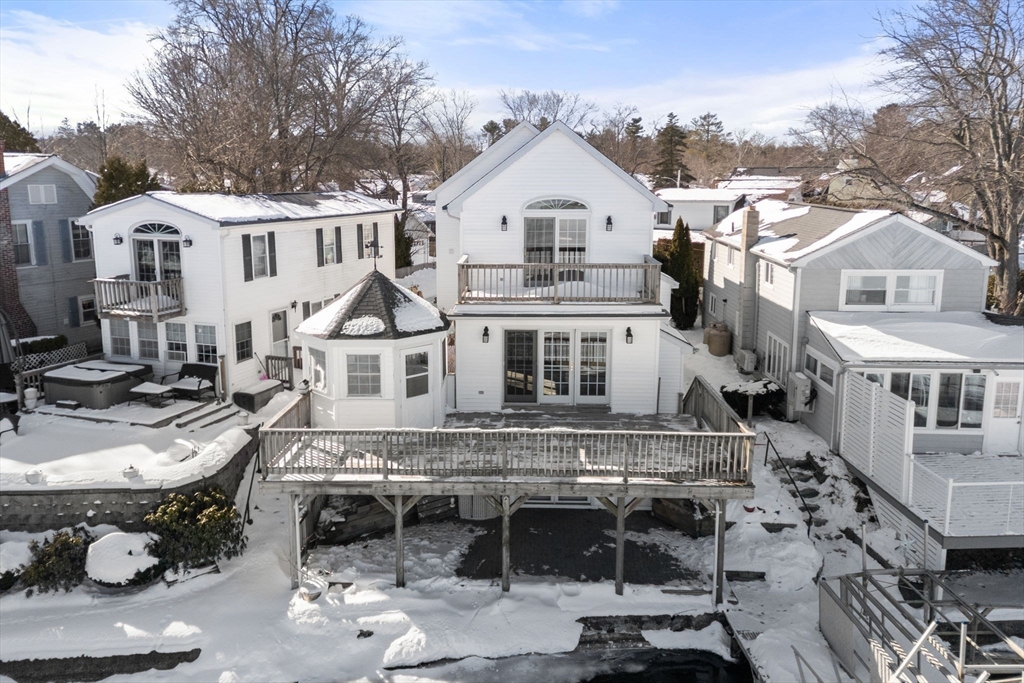 53-55 Point Pleasant Road Webster, MA 01570 - Photo 2 of 42 a view of a white house with a yard and lawn chairs