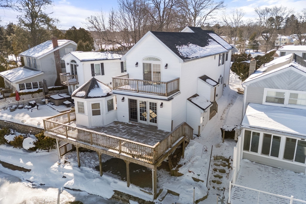 53-55 Point Pleasant Road Webster, MA 01570 - Photo 40 of 42 a view of a white house with large windows