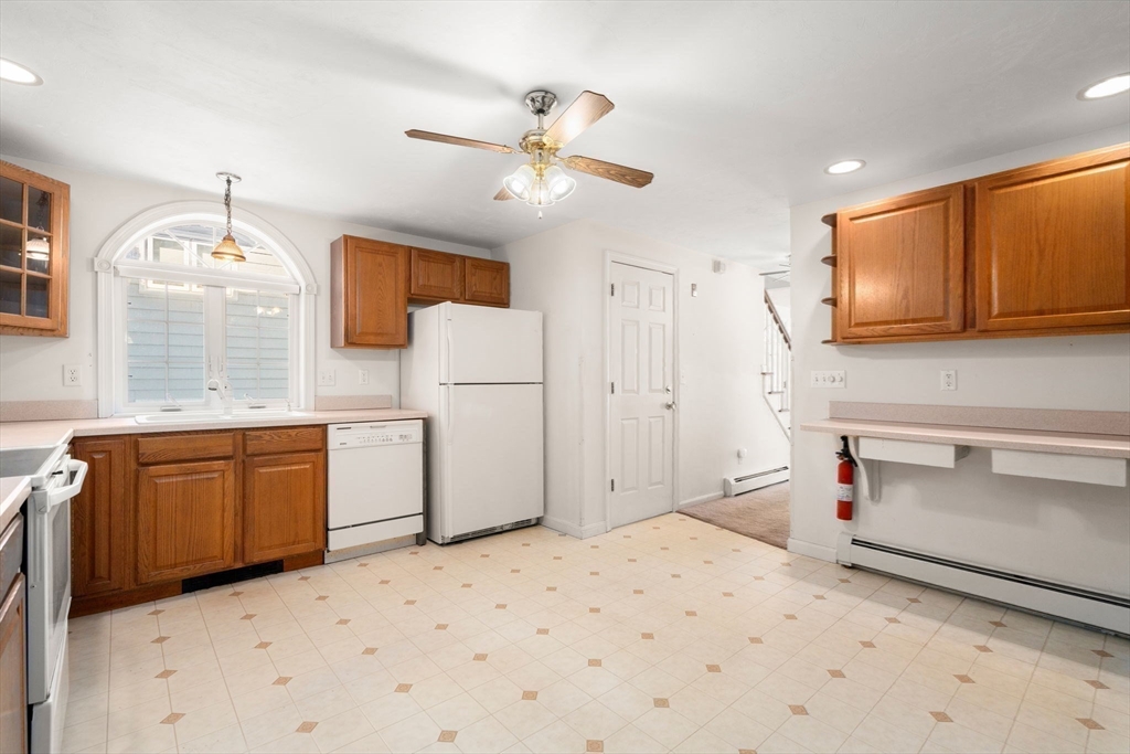 53-55 Point Pleasant Road Webster, MA 01570 - Photo 4 of 42 a kitchen with stainless steel appliances kitchen island granite countertop a sink cabinets and wooden floor
