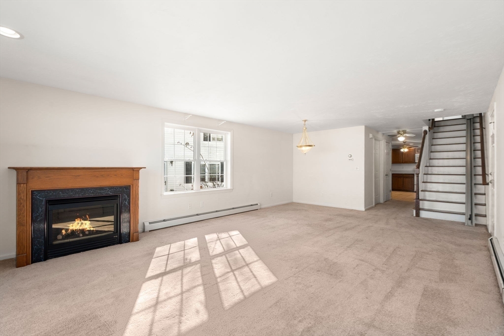 53-55 Point Pleasant Road Webster, MA 01570 - Photo 6 of 42 a view of an empty room with a fireplace