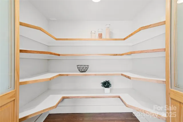 a kitchen with a dining table chairs and a counter top space