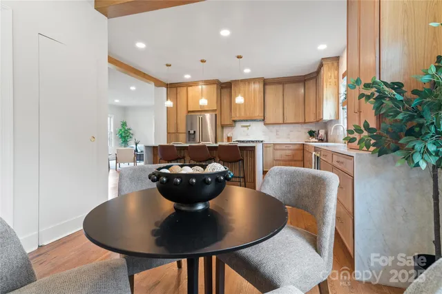 a bedroom with a bed a mirror and furniture