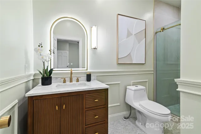 a bathroom with a toilet and shower