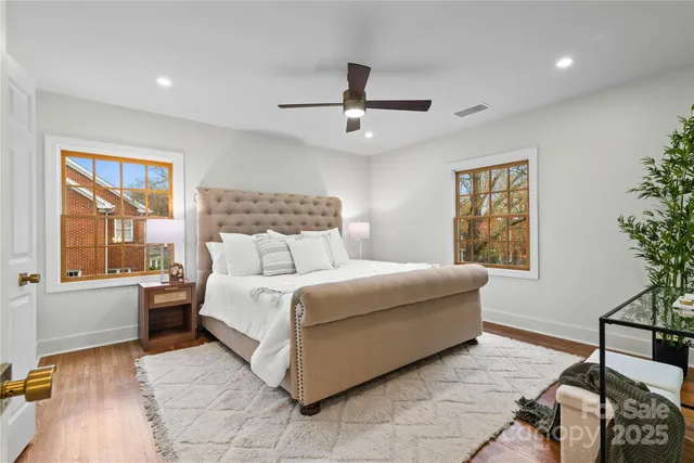 a bedroom with a bed and a lamp