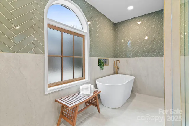 a large bathroom with a double vanity sink a toilet and a mirror