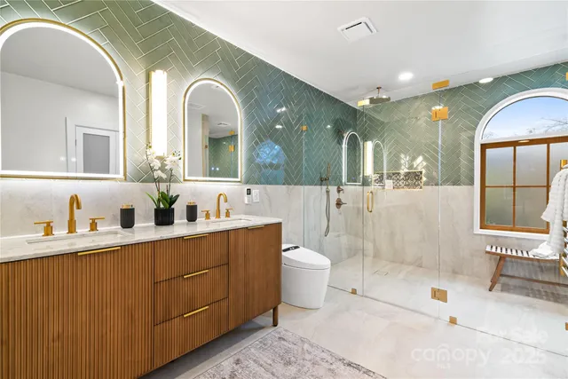 a spacious bathroom with a bathtub shower sink and toilet