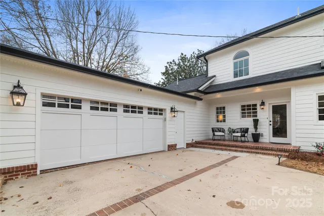 a view of a house with a snow in the yard