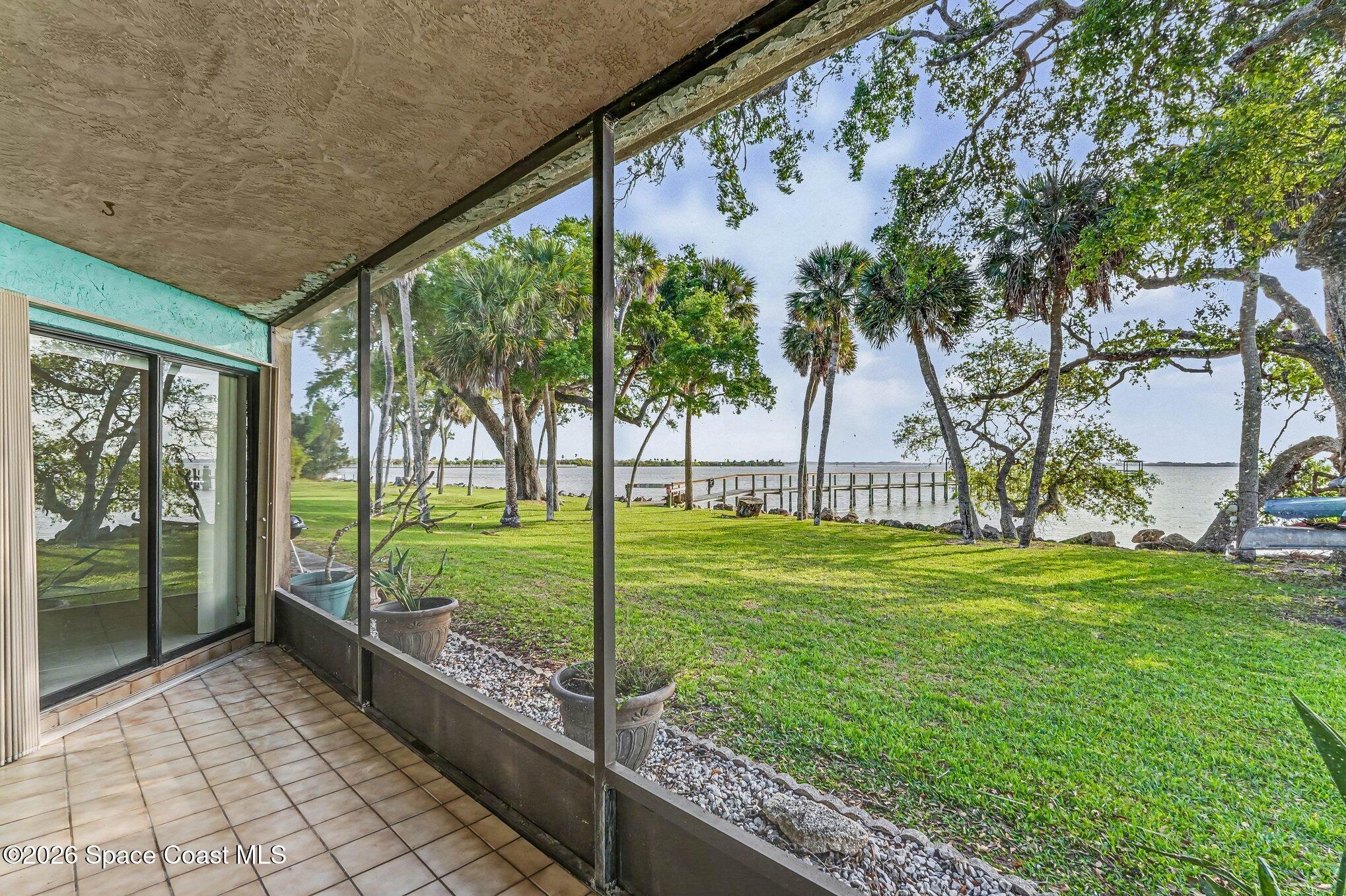 100 Canebreakers Drive, Unit 108 Cocoa, FL 32927 - Photo 15 of 17 a view of a garden and trees